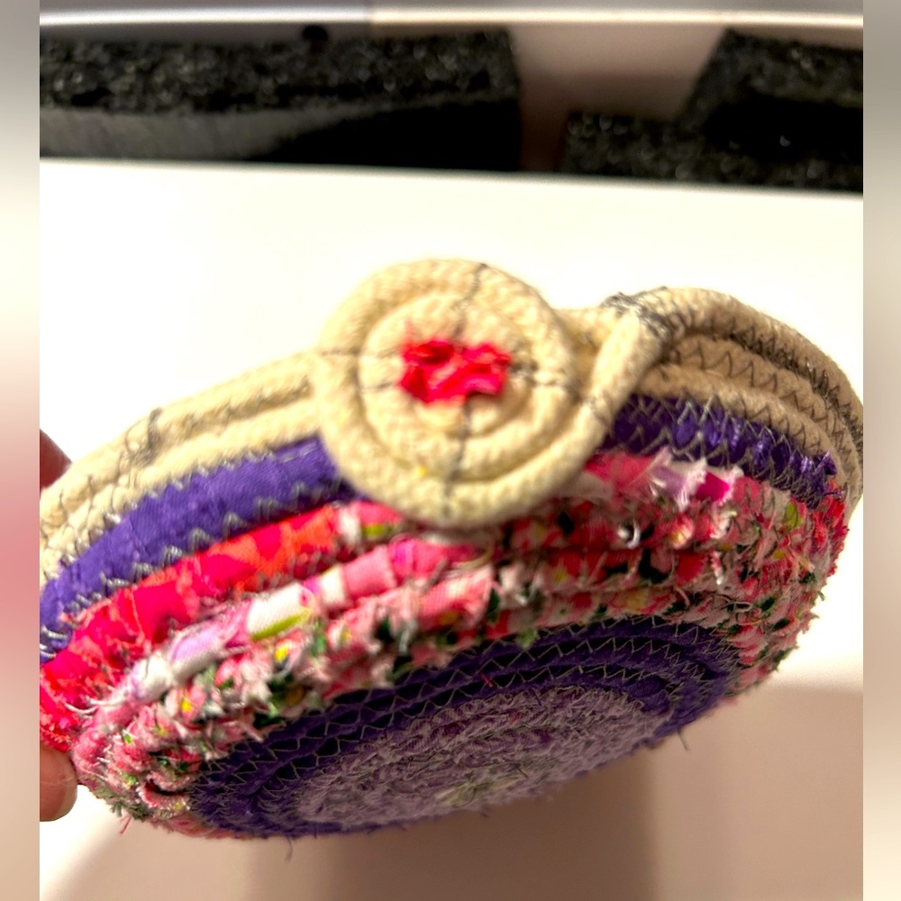 New. Hand-crafted Coiled Rope Basket in Purples and Pinks.